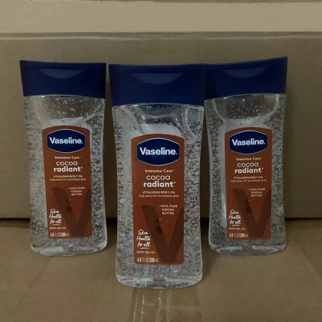 Vaseline cacao huile lumineuse pour le corps 200ml huile de soin hydratante longue durée pour la peau corps éclaircissant Anti-séchage Essence produit de soin