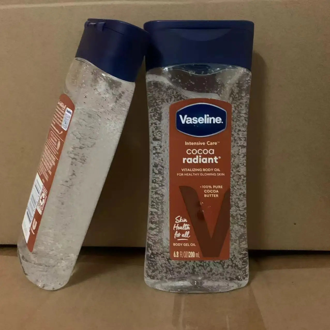 Vaseline cacao huile lumineuse pour le corps 200ml huile de soin hydratante longue durée pour la peau corps éclaircissant Anti-séchage Essence produit de soin